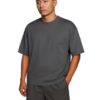 Gray Dropshoulder Oversized T-Shirt & Shorts Set Man wearing a gray dropshoulder oversized t-shirt with matching shorts, minimal streetwear fashion.
