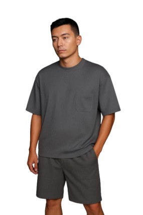 Gray Dropshoulder Oversized T-Shirt & Shorts Set Man wearing a gray dropshoulder oversized t-shirt with matching shorts, minimal streetwear fashion.